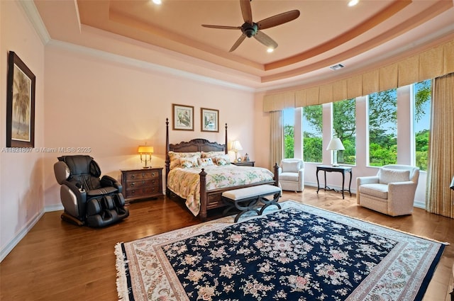 12608 S Stonebrook Cir, Davie, FL 33330 - bedroom featuring a raised ceiling, ornamental molding, recessed lighting, wood finished floors, and ceiling fan
