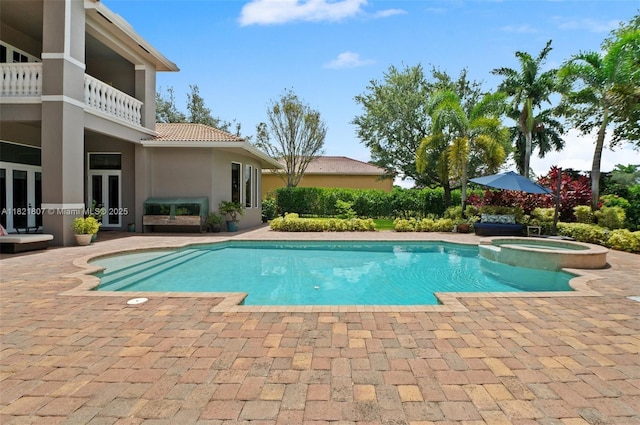 12608 S Stonebrook Cir, Davie, FL 33330 - view of pool featuring a patio area, a pool with connected hot tub, and french doors