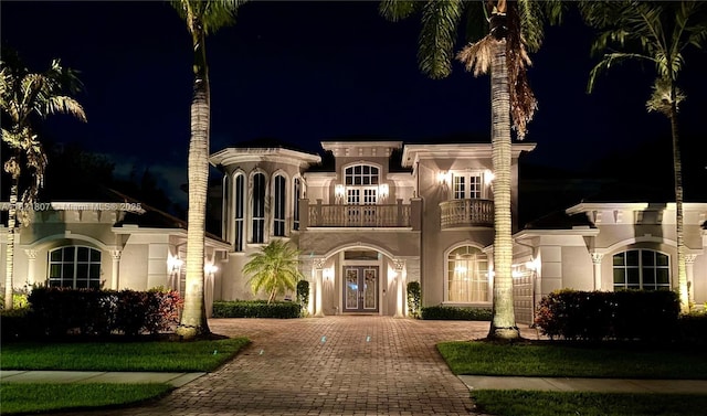 12608 S Stonebrook Cir, Davie, FL 33330 - mediterranean / spanish home with french doors, a balcony, decorative driveway, and stucco siding