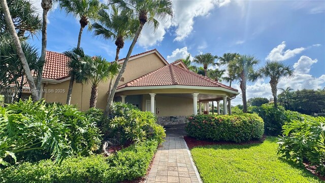 12608 S Stonebrook Cir, Davie, FL 33330 - view of front facade featuring stucco siding and a tile roof