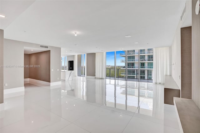 300 Sunny Isles Blvd Unit 4-Ts-04, Sunny Isles Beach, FL 33160 - spare room with light tile patterned flooring and floor to ceiling windows