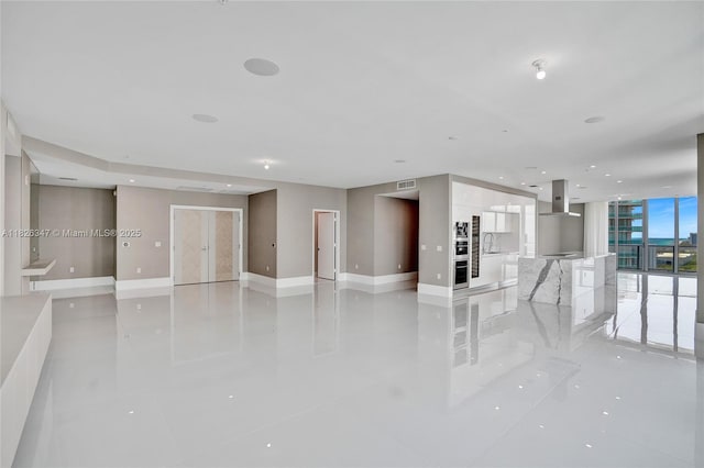 300 Sunny Isles Blvd Unit 4-Ts-04, Sunny Isles Beach, FL 33160 - unfurnished living room with light tile patterned floors and recessed lighting