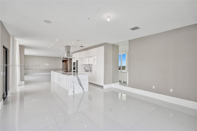 300 Sunny Isles Blvd Unit 4-Ts-04, Sunny Isles Beach, FL 33160 - unfurnished living room featuring light tile patterned floors and recessed lighting
