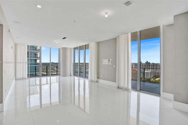 300 Sunny Isles Blvd Unit 4-Ts-04, Sunny Isles Beach, FL 33160 - unfurnished room with floor to ceiling windows and light tile patterned flooring