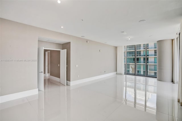 300 Sunny Isles Blvd Unit 4-Ts-04, Sunny Isles Beach, FL 33160 - tiled spare room with expansive windows and recessed lighting