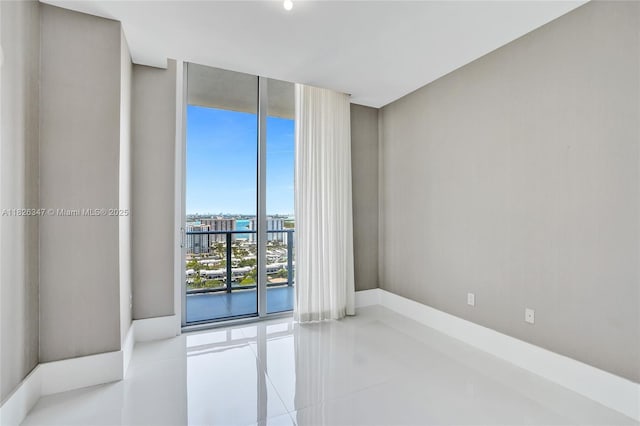300 Sunny Isles Blvd Unit 4-Ts-04, Sunny Isles Beach, FL 33160 - tiled spare room with floor to ceiling windows and baseboards