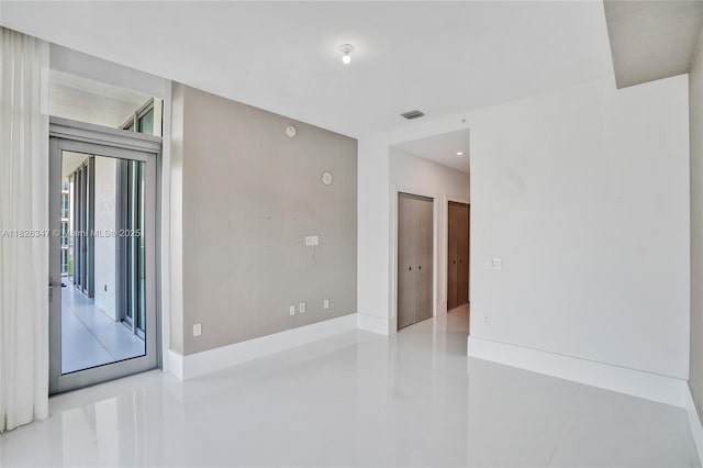 300 Sunny Isles Blvd Unit 4-Ts-04, Sunny Isles Beach, FL 33160 - spare room featuring tile patterned floors and baseboards
