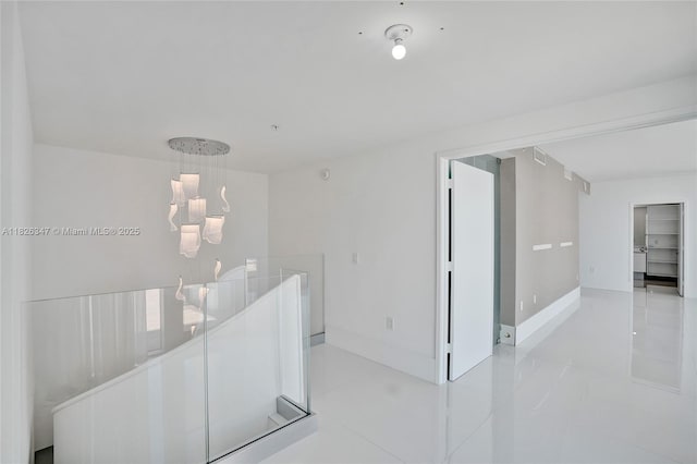 300 Sunny Isles Blvd Unit 4-Ts-04, Sunny Isles Beach, FL 33160 - corridor with light tile patterned floors and a chandelier