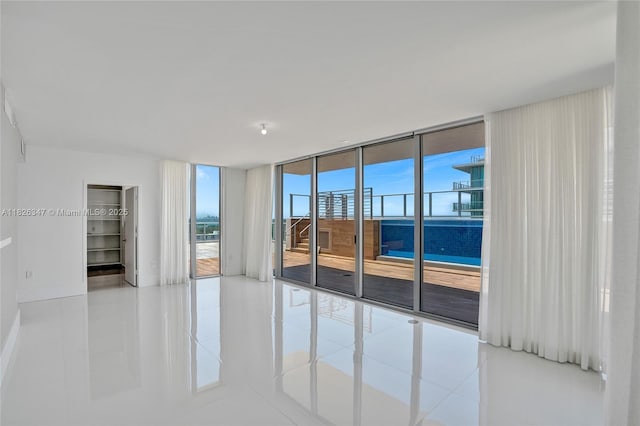 300 Sunny Isles Blvd Unit 4-Ts-04, Sunny Isles Beach, FL 33160 - tiled spare room with floor to ceiling windows