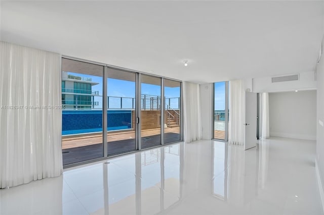300 Sunny Isles Blvd Unit 4-Ts-04, Sunny Isles Beach, FL 33160 - tiled spare room featuring a wall of windows