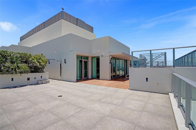 300 Sunny Isles Blvd Unit 4-Ts-04, Sunny Isles Beach, FL 33160 - rear view of property featuring stucco siding and a patio