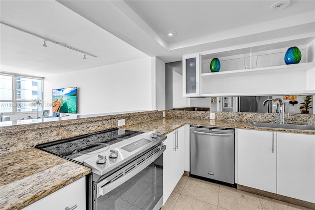 11 Island Ave Unit 1103, Miami Beach, FL 33139 - kitchen with stainless steel appliances, open shelves, white cabinetry, light stone counters, and recessed lighting