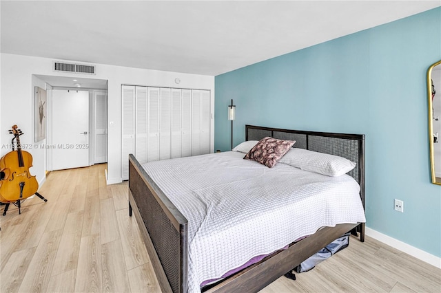 11 Island Ave Unit 1103, Miami Beach, FL 33139 - bedroom featuring light wood-style flooring and a closet