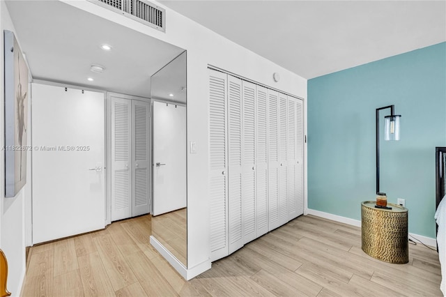 11 Island Ave Unit 1103, Miami Beach, FL 33139 - unfurnished bedroom with wood finished floors and recessed lighting