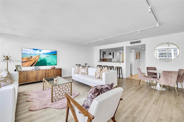 11 Island Ave Unit 1103, Miami Beach, FL 33139 - living room featuring track lighting and light wood finished floors
