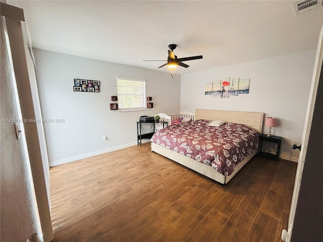 27064 Omni Ln, Punta Gorda, FL 33983 - bedroom featuring wood finished floors and ceiling fan