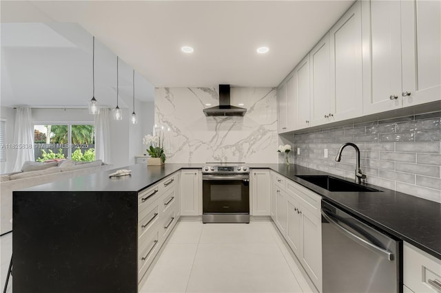 9248 Magnolia Ct, Davie, FL 33328 - kitchen with appliances with stainless steel finishes, extractor fan, open floor plan, tasteful backsplash, and a peninsula