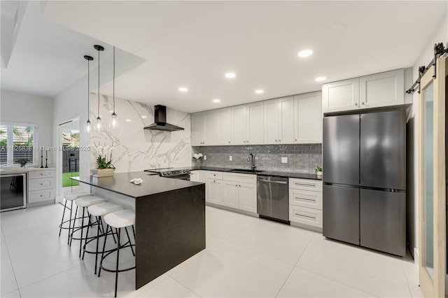 9248 Magnolia Ct, Davie, FL 33328 - kitchen featuring appliances with stainless steel finishes, wall chimney range hood, dark countertops, decorative backsplash, and recessed lighting