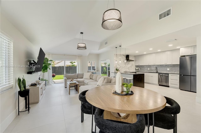 9248 Magnolia Ct, Davie, FL 33328 - dining space with vaulted ceiling and light tile patterned flooring