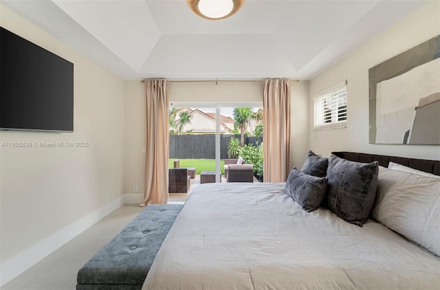 9248 Magnolia Ct, Davie, FL 33328 - tiled bedroom featuring a raised ceiling and access to outside