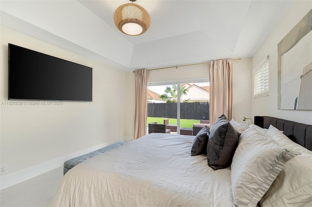 9248 Magnolia Ct, Davie, FL 33328 - bedroom with a tray ceiling and access to exterior