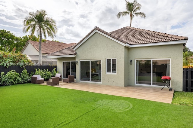 9248 Magnolia Ct, Davie, FL 33328 - back of property with stucco siding, a wooden deck, outdoor lounge area, and a tile roof