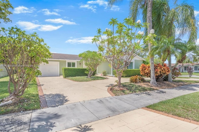 13245 SW 86th Ln, Miami, FL 33183 - view of front of home featuring concrete driveway, an attached garage, and stucco siding