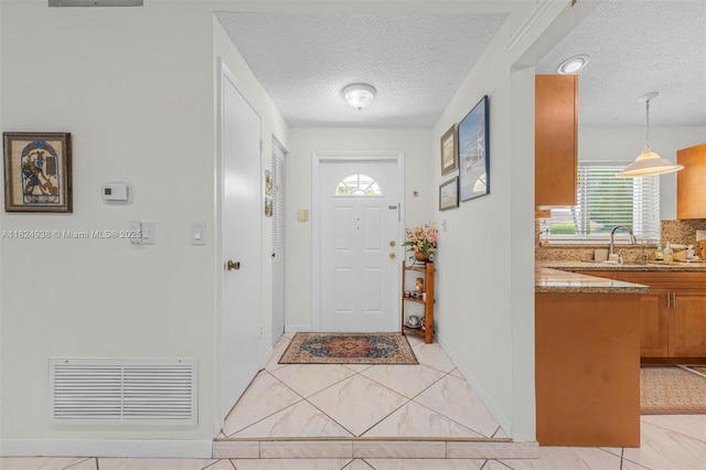 13245 SW 86th Ln, Miami, FL 33183 - entryway with a textured ceiling and baseboards