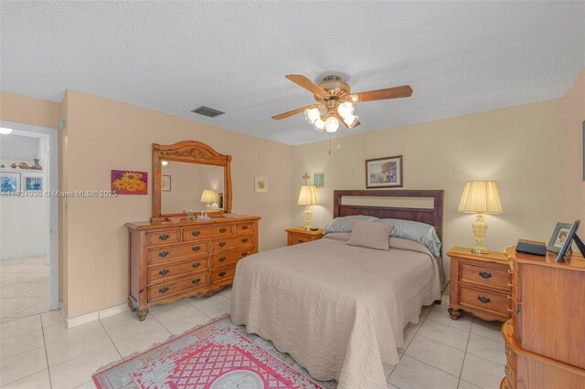 13245 SW 86th Ln, Miami, FL 33183 - bedroom featuring light tile patterned flooring, a ceiling fan, and a textured ceiling