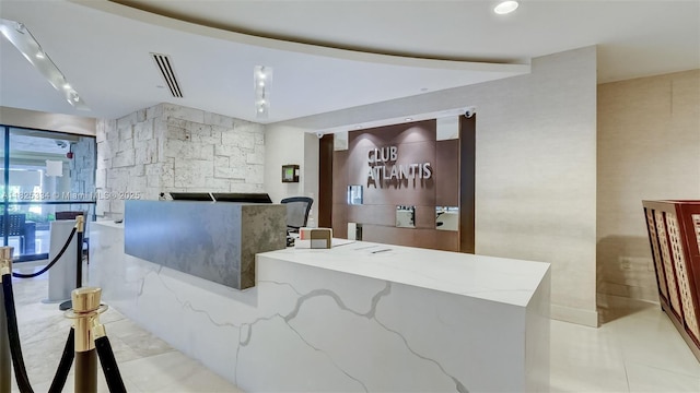 2555 Collins Ave Unit 606, Miami Beach, FL 33140 - welcome area with a stone fireplace