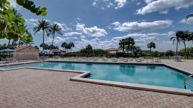 2555 Collins Ave Unit 606, Miami Beach, FL 33140 - community pool with a patio area and a gazebo