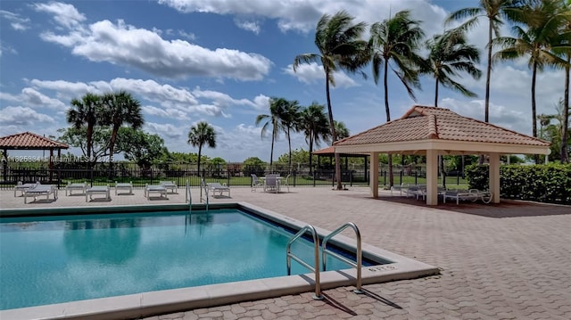 2555 Collins Ave Unit 606, Miami Beach, FL 33140 - community pool featuring a gazebo and a patio