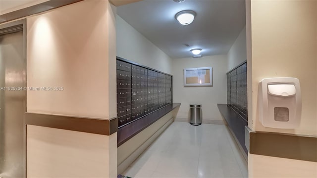2555 Collins Ave Unit 606, Miami Beach, FL 33140 - corridor featuring mail area and baseboards