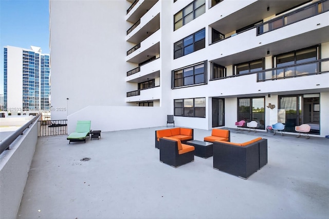 2555 Collins Ave Unit 606, Miami Beach, FL 33140 - view of patio / terrace featuring outdoor lounge area