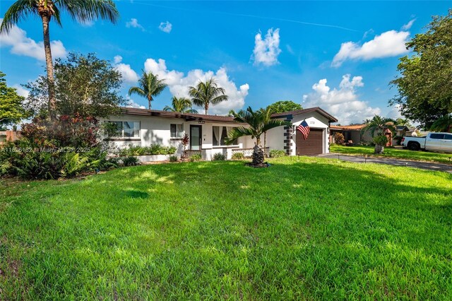 1770 NW 106th Ave, Pembroke Pines, FL 33026 - single story home featuring an attached garage, a front yard, driveway, and stucco siding