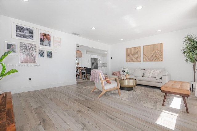 1770 NW 106th Ave, Pembroke Pines, FL 33026 - living area with light wood-style flooring and recessed lighting