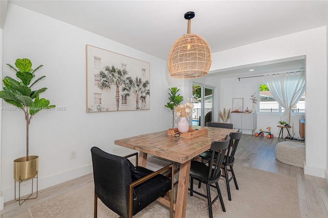 1770 NW 106th Ave, Pembroke Pines, FL 33026 - dining area featuring light wood finished floors and a chandelier