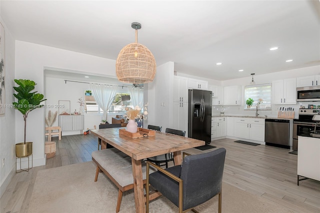 1770 NW 106th Ave, Pembroke Pines, FL 33026 - dining area featuring light wood-style flooring, a chandelier, and recessed lighting