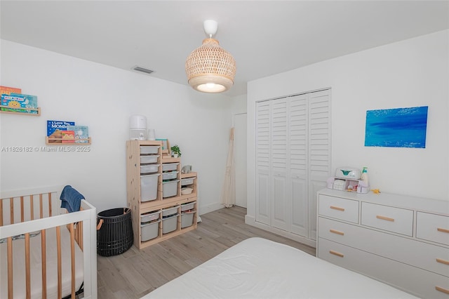 1770 NW 106th Ave, Pembroke Pines, FL 33026 - bedroom featuring light wood-type flooring, a closet, and a crib