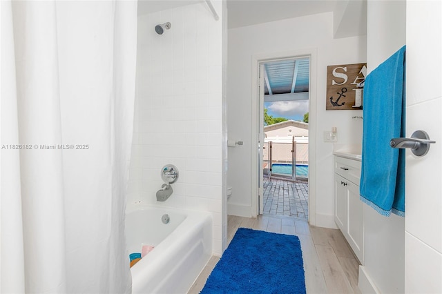 1770 NW 106th Ave, Pembroke Pines, FL 33026 - bathroom with shower / bath combo with shower curtain, vanity, and wood finished floors