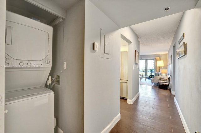 1201 S Ocean Dr Unit 218N, Hollywood, FL 33019 - laundry area with stacked washer / drying machine and a textured ceiling