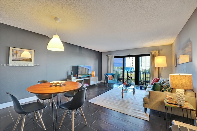 1201 S Ocean Dr Unit 218N, Hollywood, FL 33019 - dining room with a textured ceiling and dark tile patterned floors