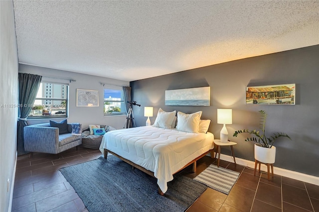 1201 S Ocean Dr Unit 218N, Hollywood, FL 33019 - tiled bedroom featuring a textured ceiling