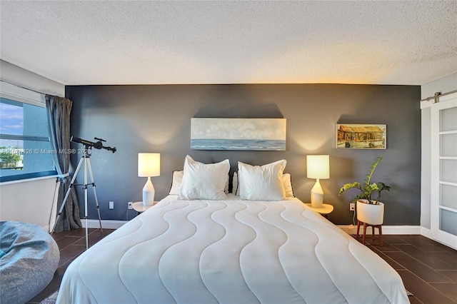 1201 S Ocean Dr Unit 218N, Hollywood, FL 33019 - tiled bedroom with a textured ceiling and baseboards