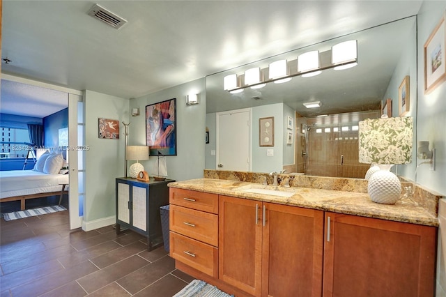 1201 S Ocean Dr Unit 218N, Hollywood, FL 33019 - bathroom with a shower stall, vanity, connected bathroom, and tile patterned floors
