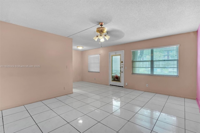 13255 SW 7th Ct Unit 113D, Pembroke Pines, FL 33027 - spare room with ceiling fan, light tile patterned floors, and a textured ceiling