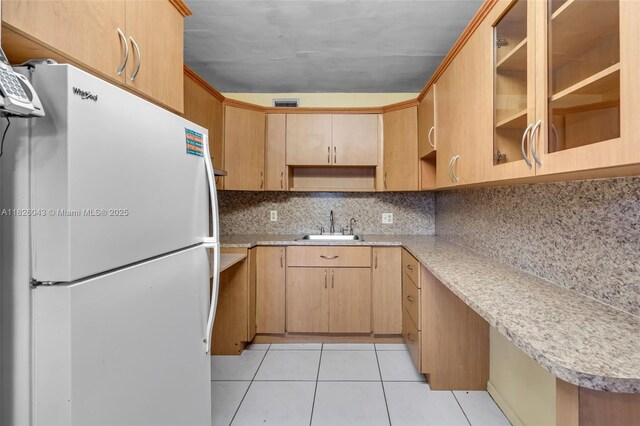 13255 SW 7th Ct Unit 113D, Pembroke Pines, FL 33027 - kitchen with freestanding refrigerator, open shelves, light tile patterned flooring, light countertops, and decorative backsplash
