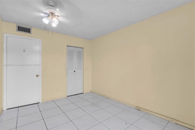 13255 SW 7th Ct Unit 113D, Pembroke Pines, FL 33027 - unfurnished bedroom featuring a closet, ceiling fan, and light tile patterned floors