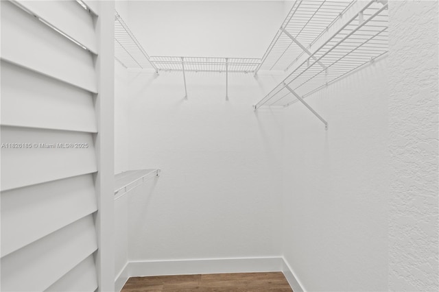 11581 SW 10th Ct, Pembroke Pines, FL 33025 - spacious closet featuring wood finished floors