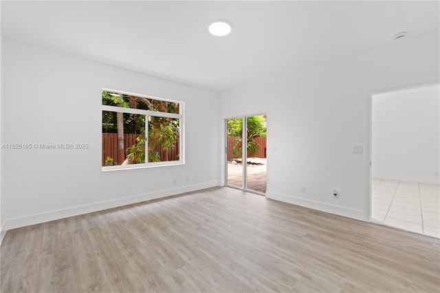11581 SW 10th Ct, Pembroke Pines, FL 33025 - unfurnished room featuring light wood-style floors and a smoke detector